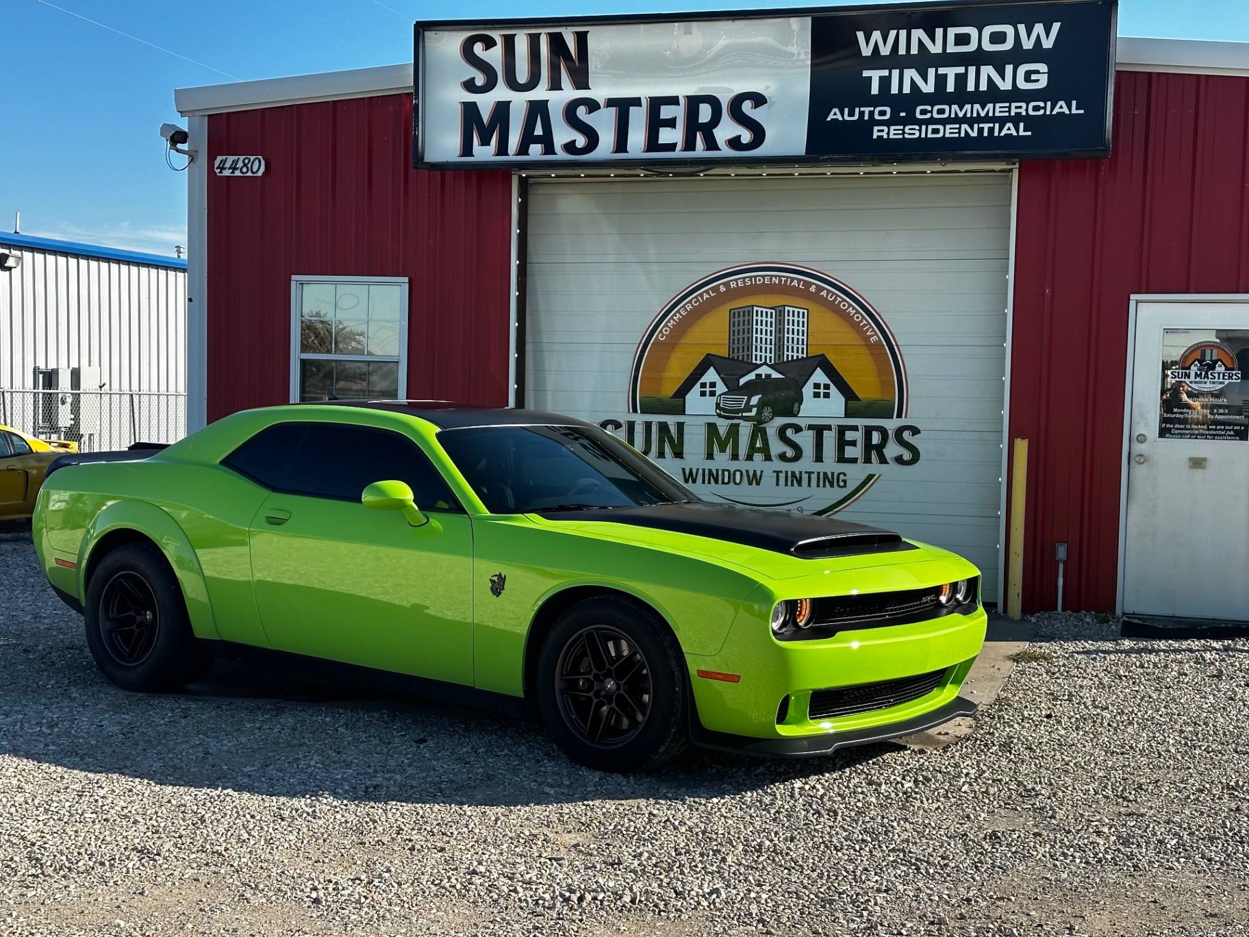 Green Dodge Challenger with window tinting at Sun Masters