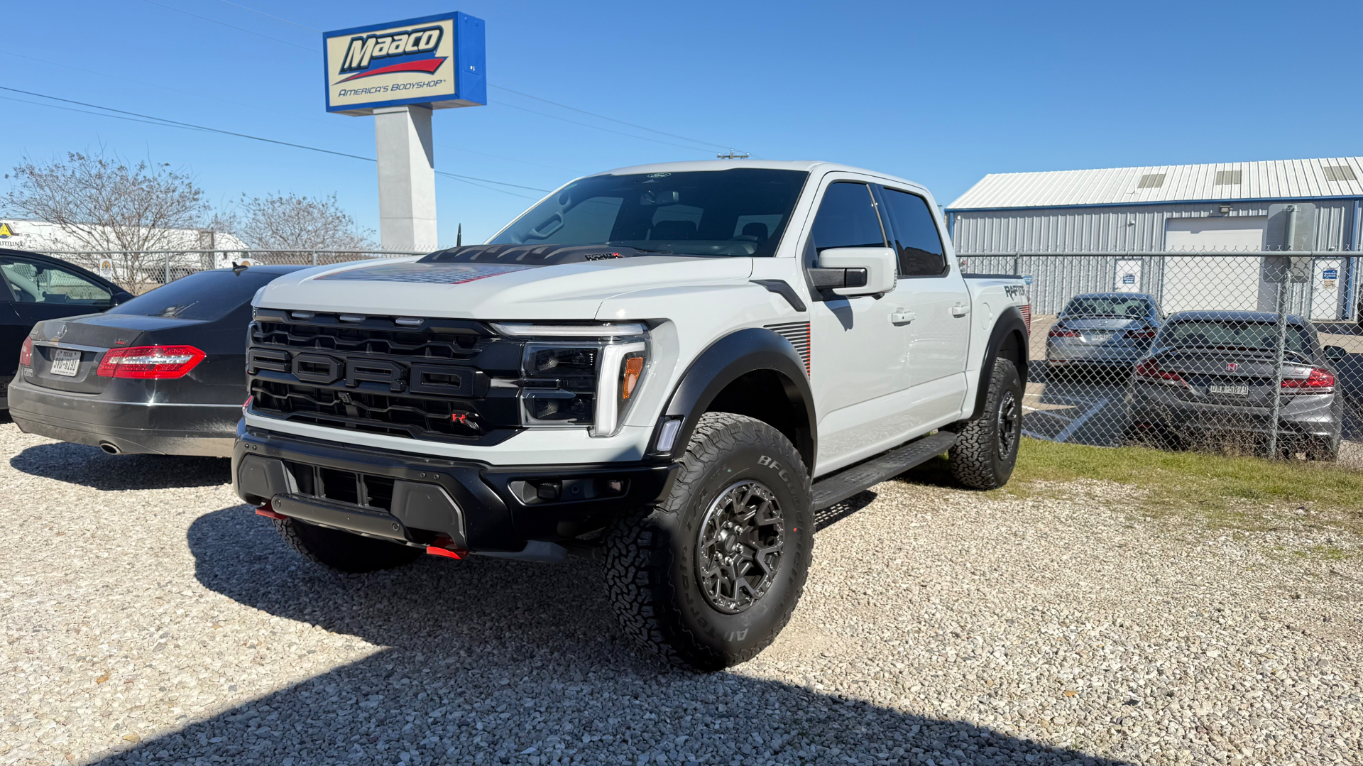 White Ford F-150 Raptor with window tinting