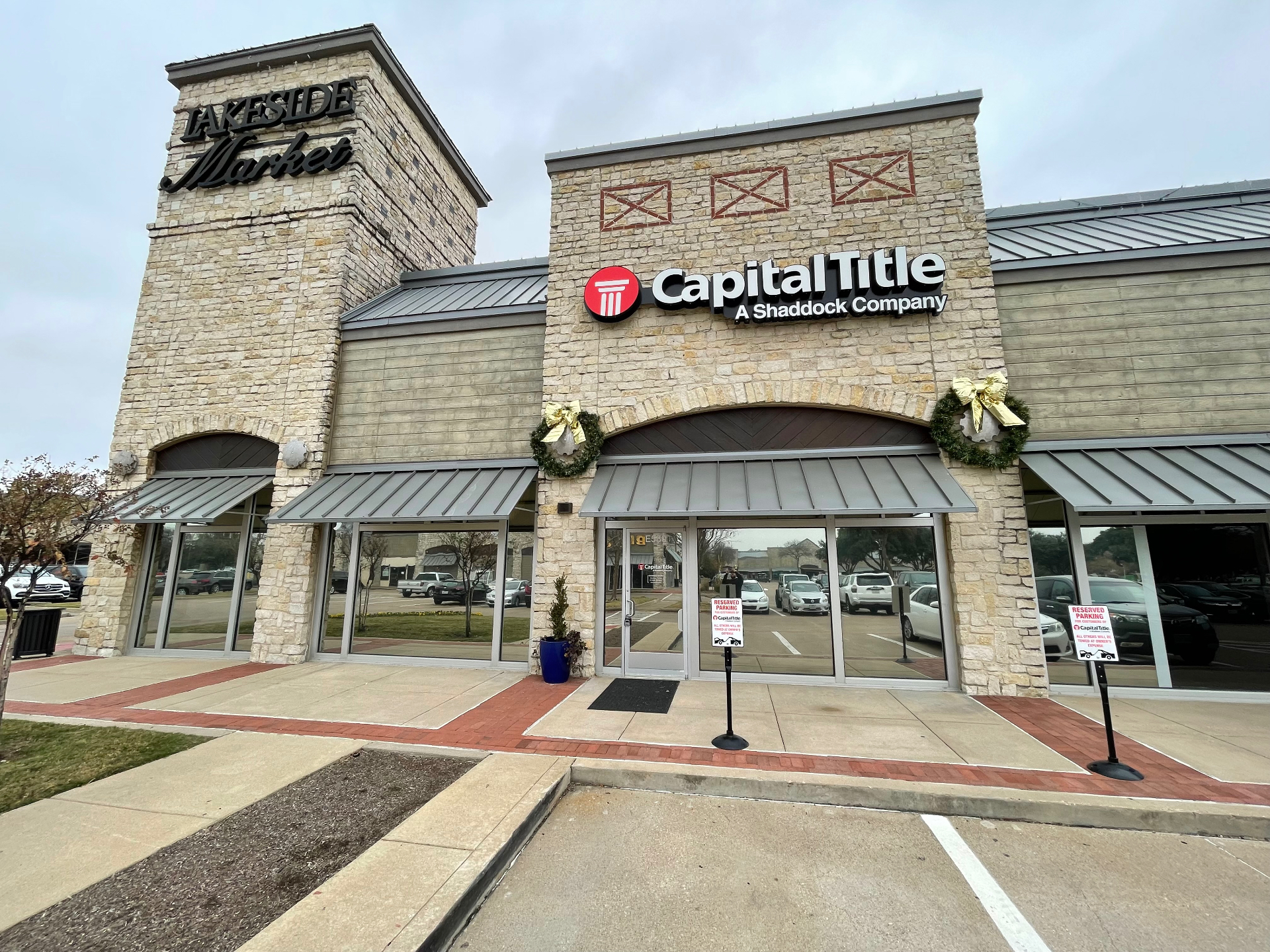 Capital Title office storefront in stone building with tinted windows