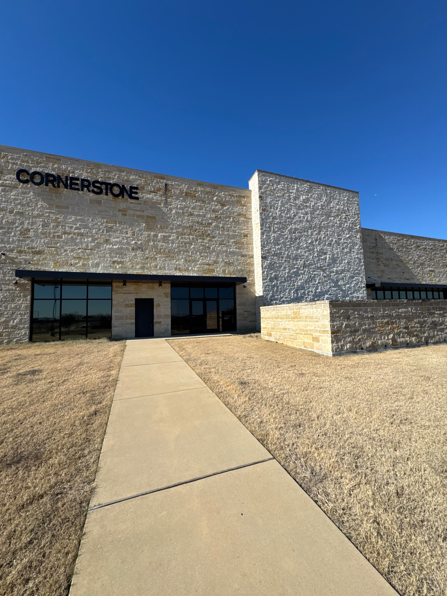 Cornerstone commercial building with window tinting installation