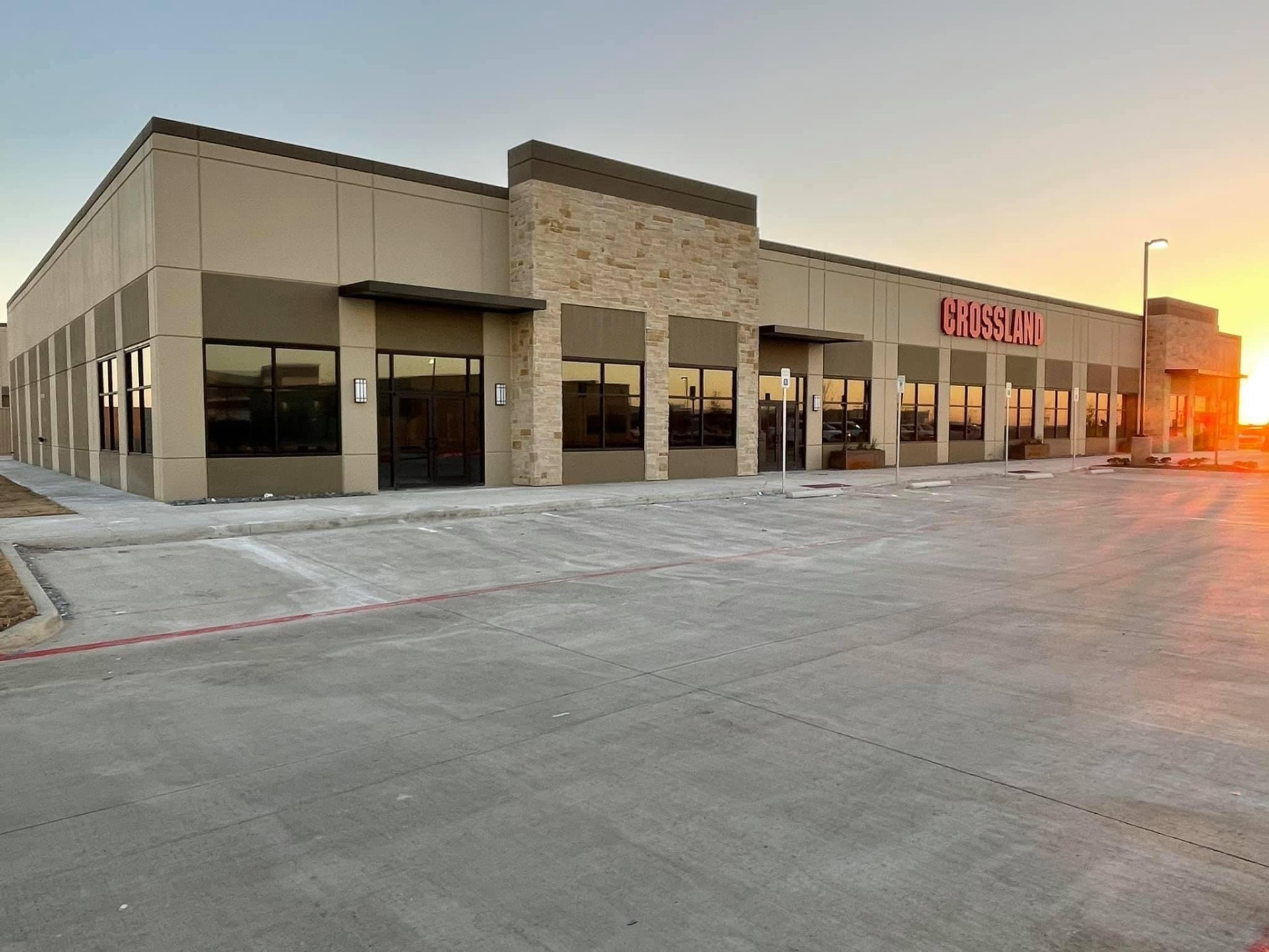 Crossland commercial building with window tinting at sunset