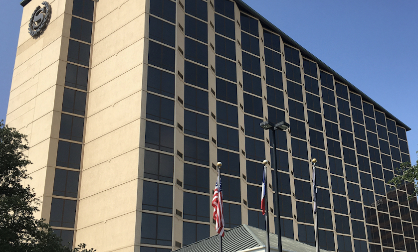 Commercial office tower with tinted windows in DFW