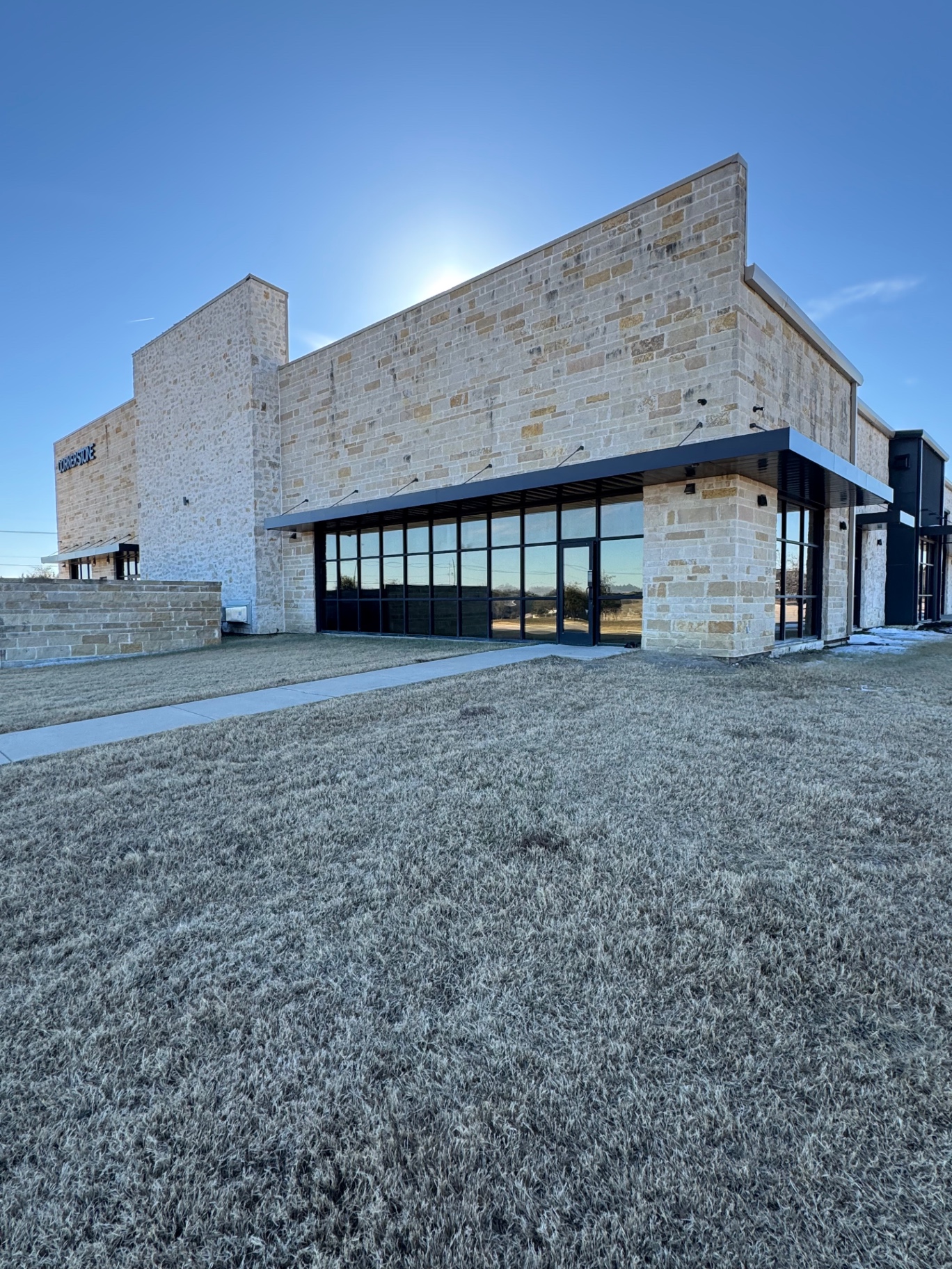 Commercial stone building with professional window tinting in Rockwall
