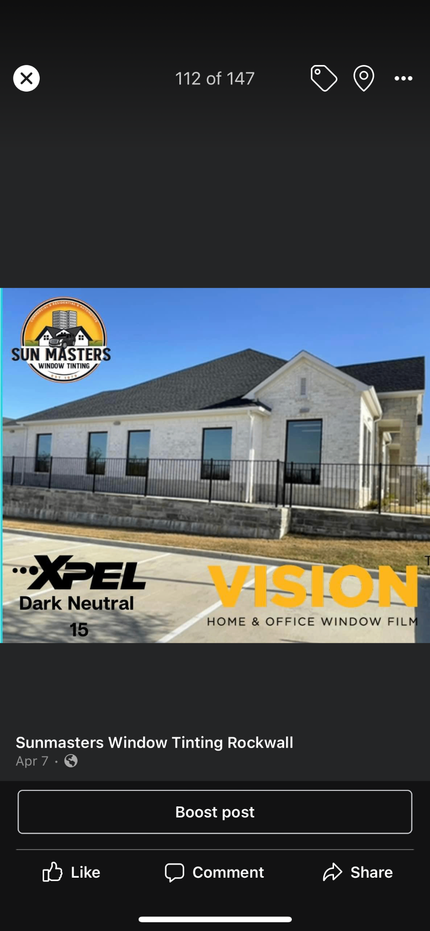 Modern white brick office building with XPEL Vision window film