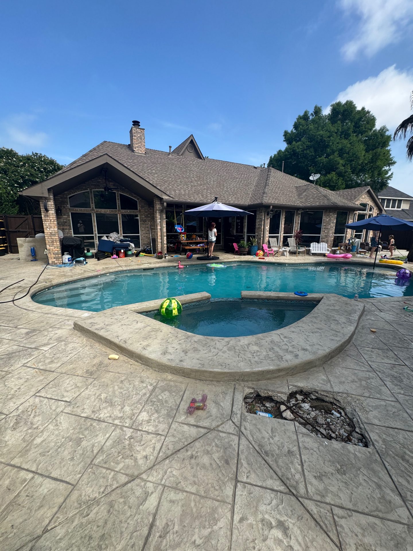 Family home with tinted windows overlooking pool
