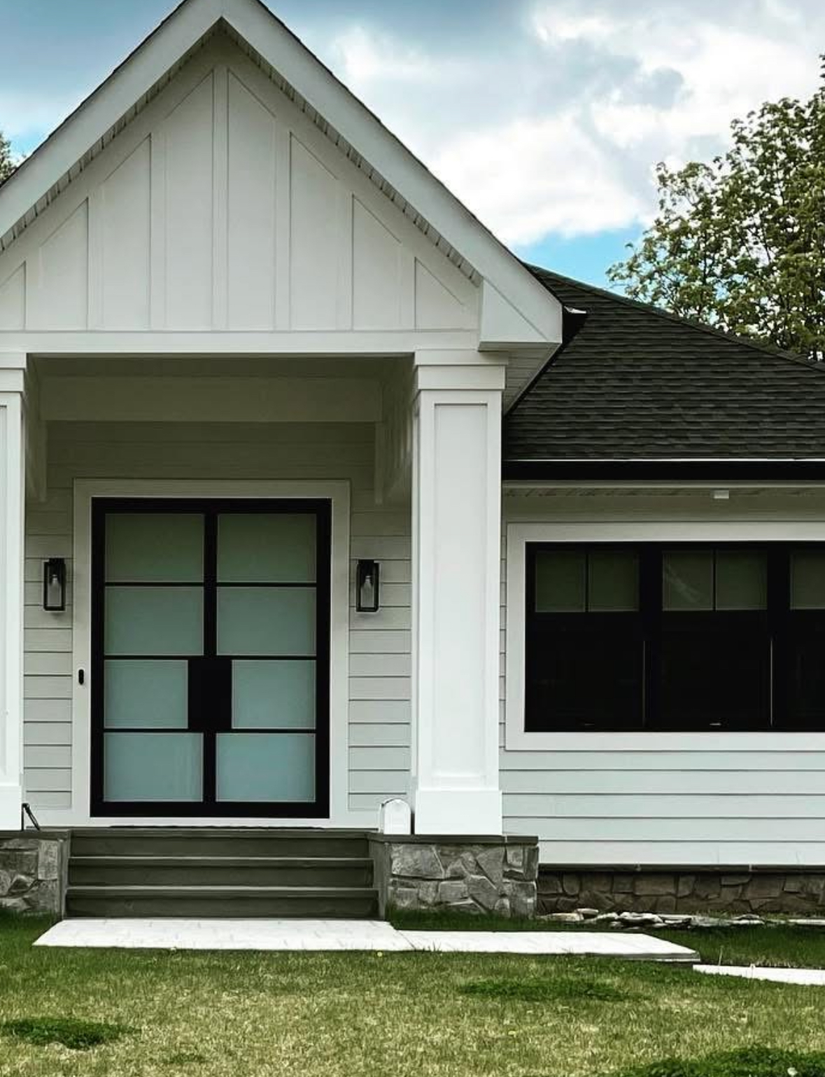 White cottage with frosted door and tinted windows